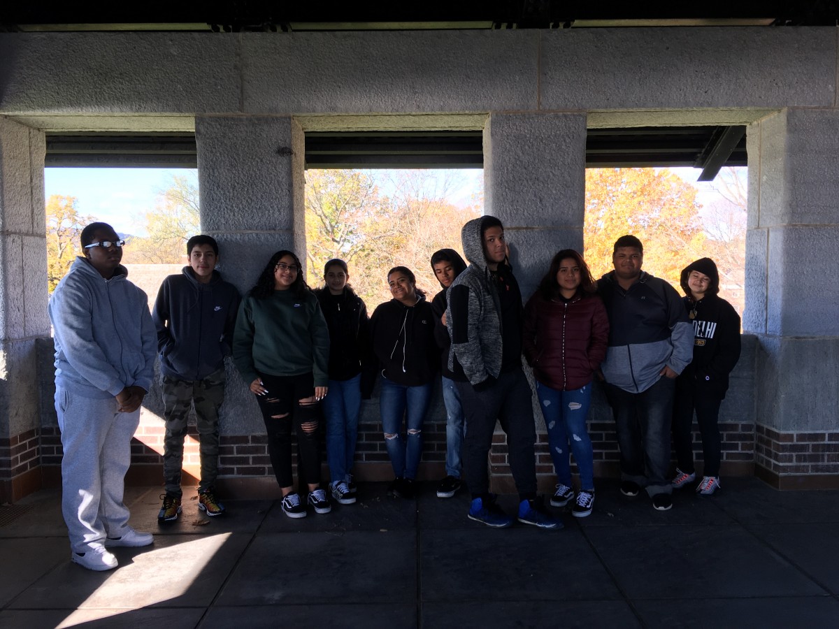 Students look at historic photos.