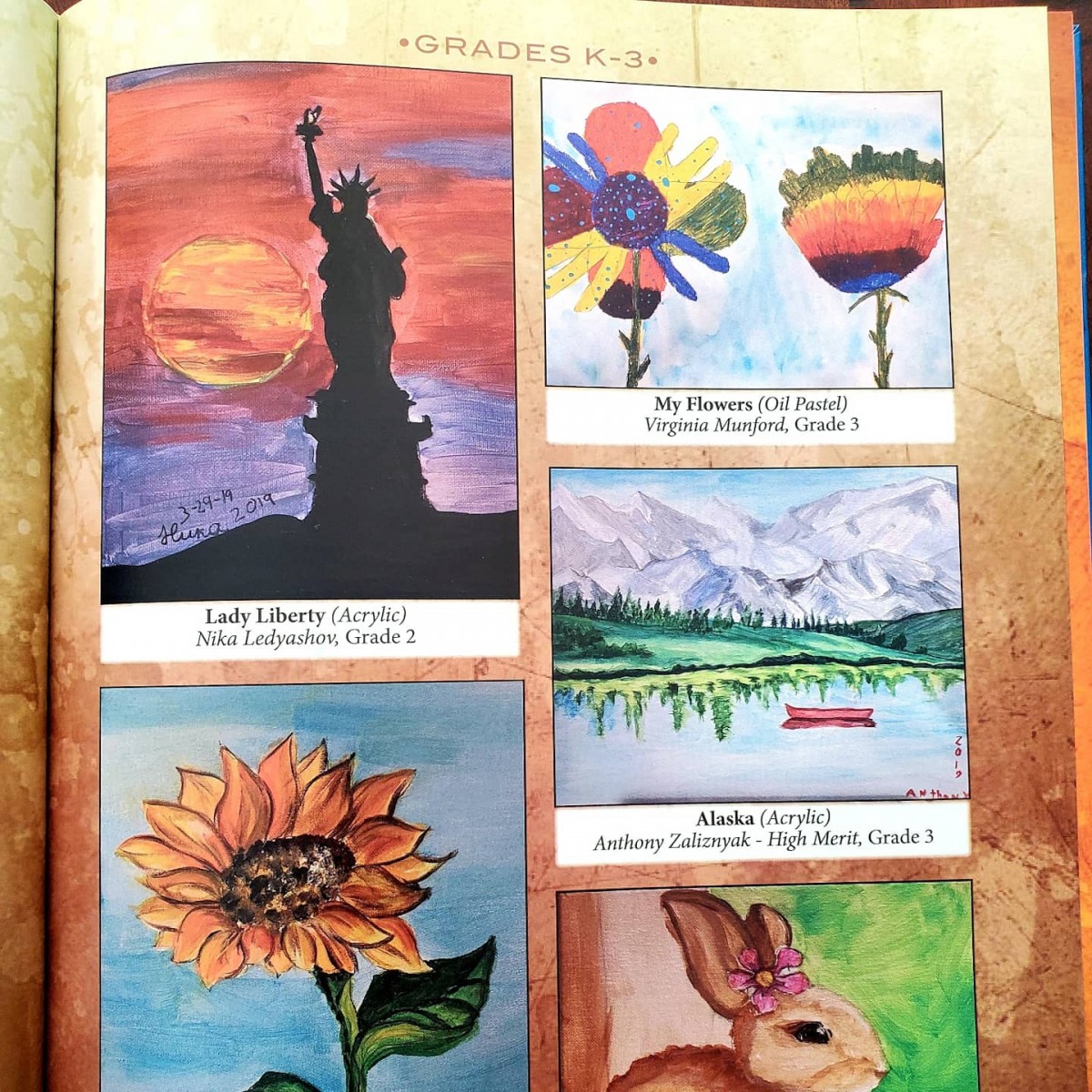 Pages of the book with artwork submitted by Meadow Hill scholars.