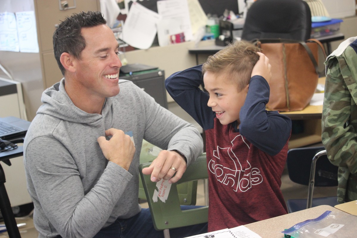 Father and child laughing.