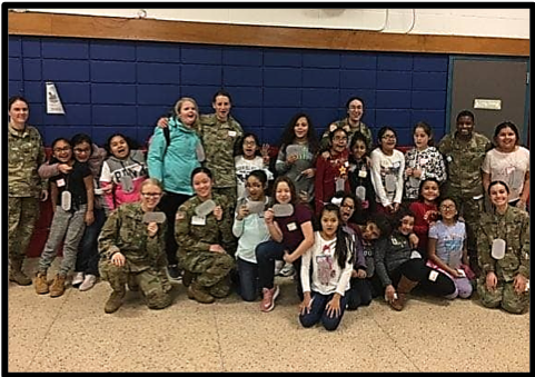 Group photo of the Meadow Hill  5th grade girls with the Fireworks! team.