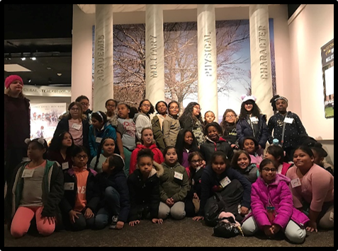 4th and 5th grade girls standing with the USMA Pillars at the Visitor’s Center