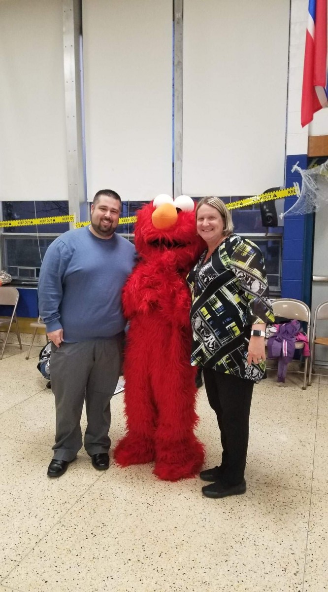 Mr. Prokosch and Ms. Russell pose with Elmo.