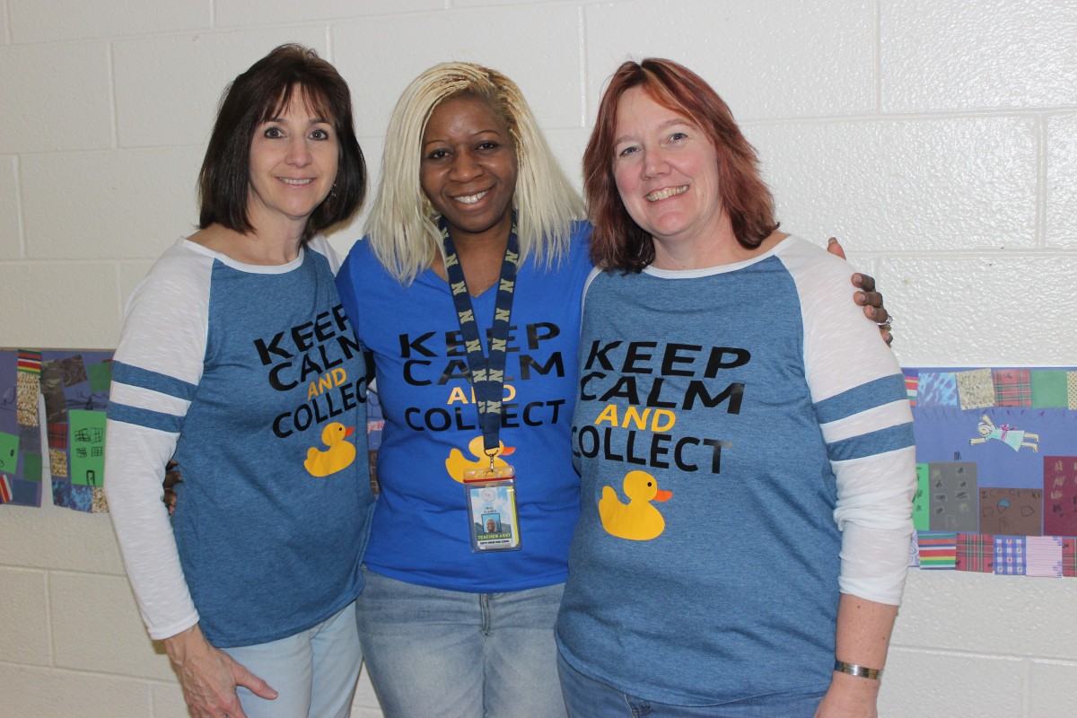 Teachers pose for a photo.