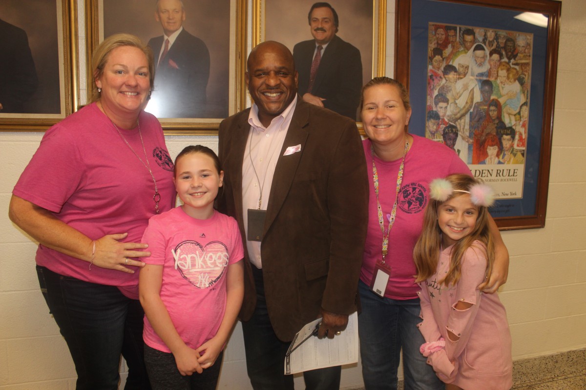 Participants pose for photo in pink.