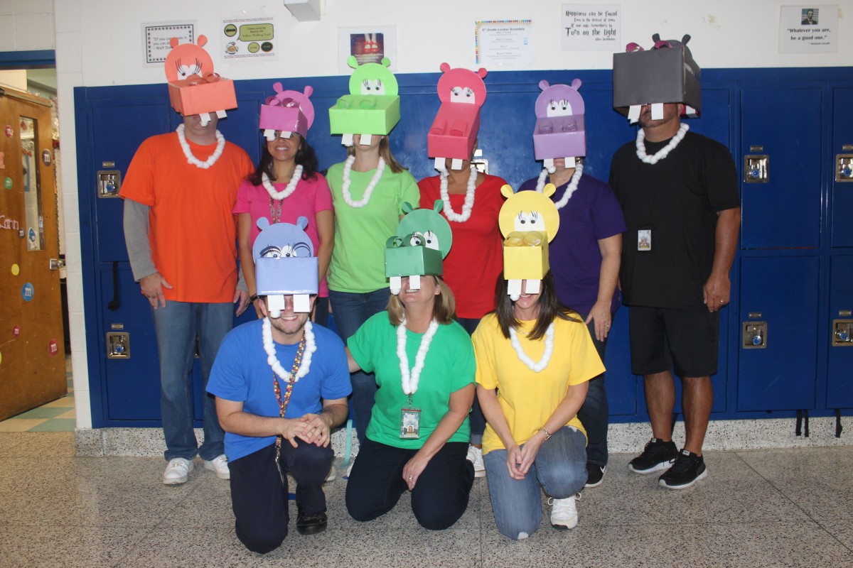 Teachers pose in their Hungry Hungry Hipposcostumes.