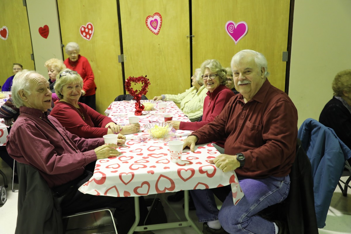 Participants seated at their table.