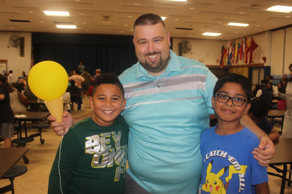 Students and principal pose for a photo.