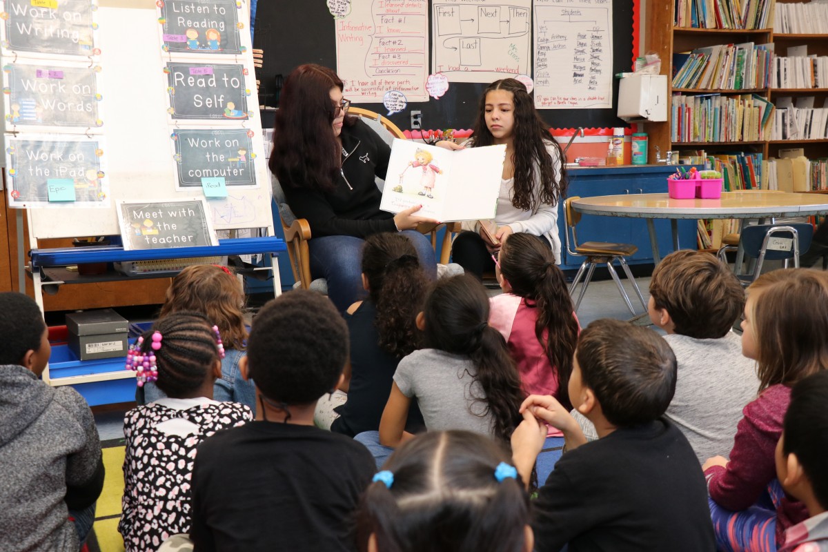 High school scholars read to first grade scholars.