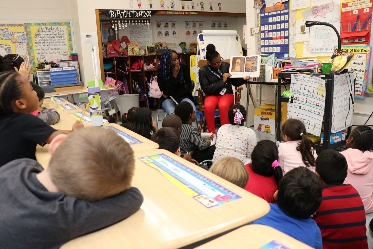 High school scholars read to first grade scholars.