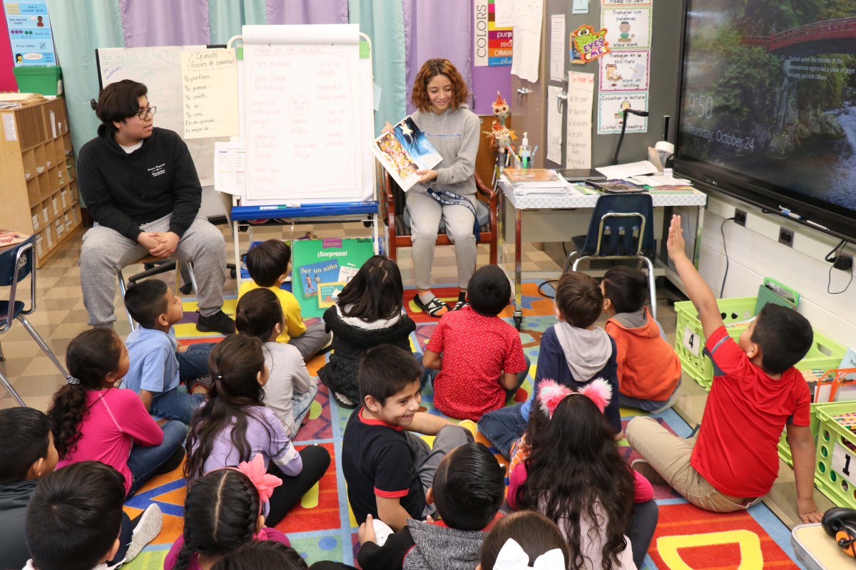 High school scholars read to first grade scholars.