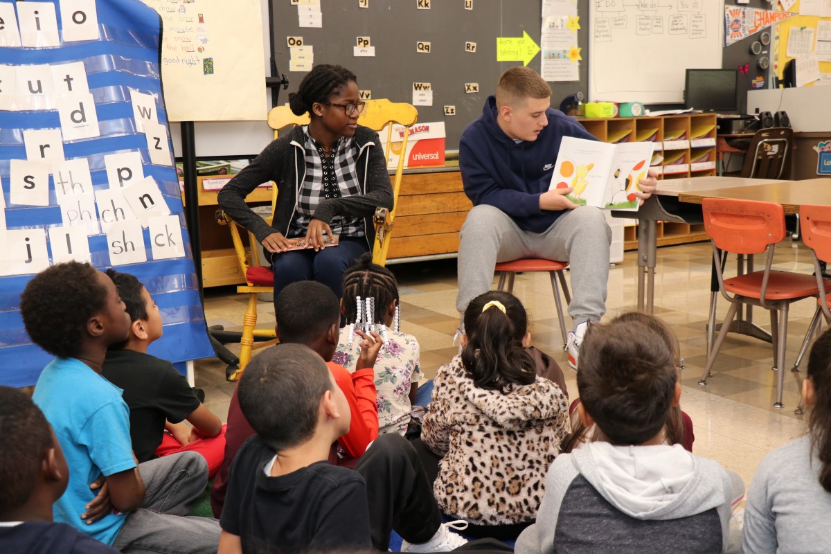 High school scholars read to first grade scholars.