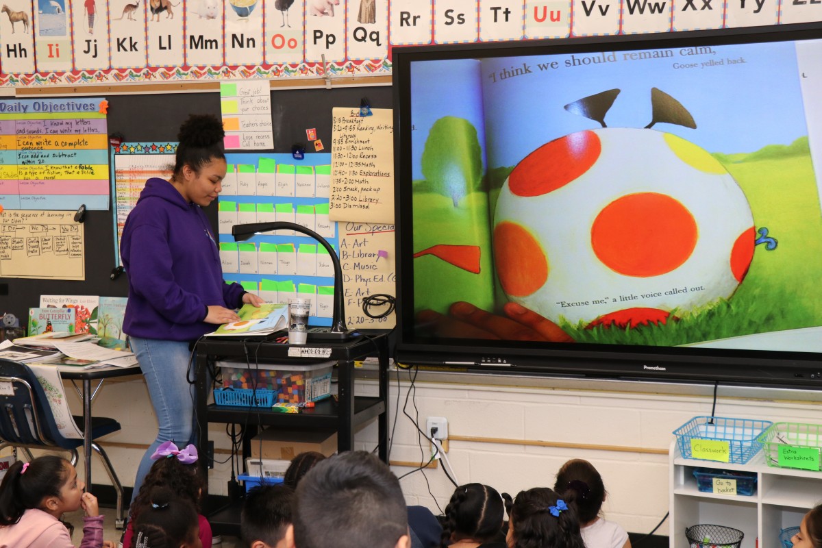 High school scholars read to first grade scholars.