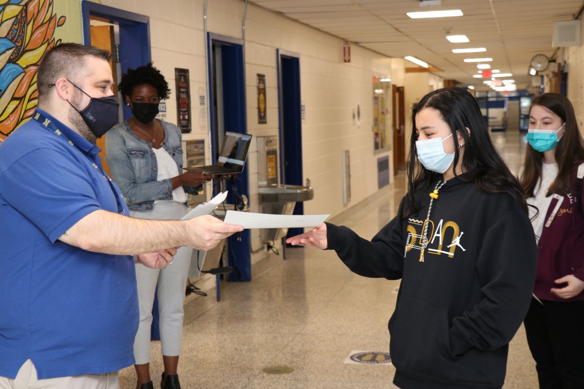 Student receiving award.