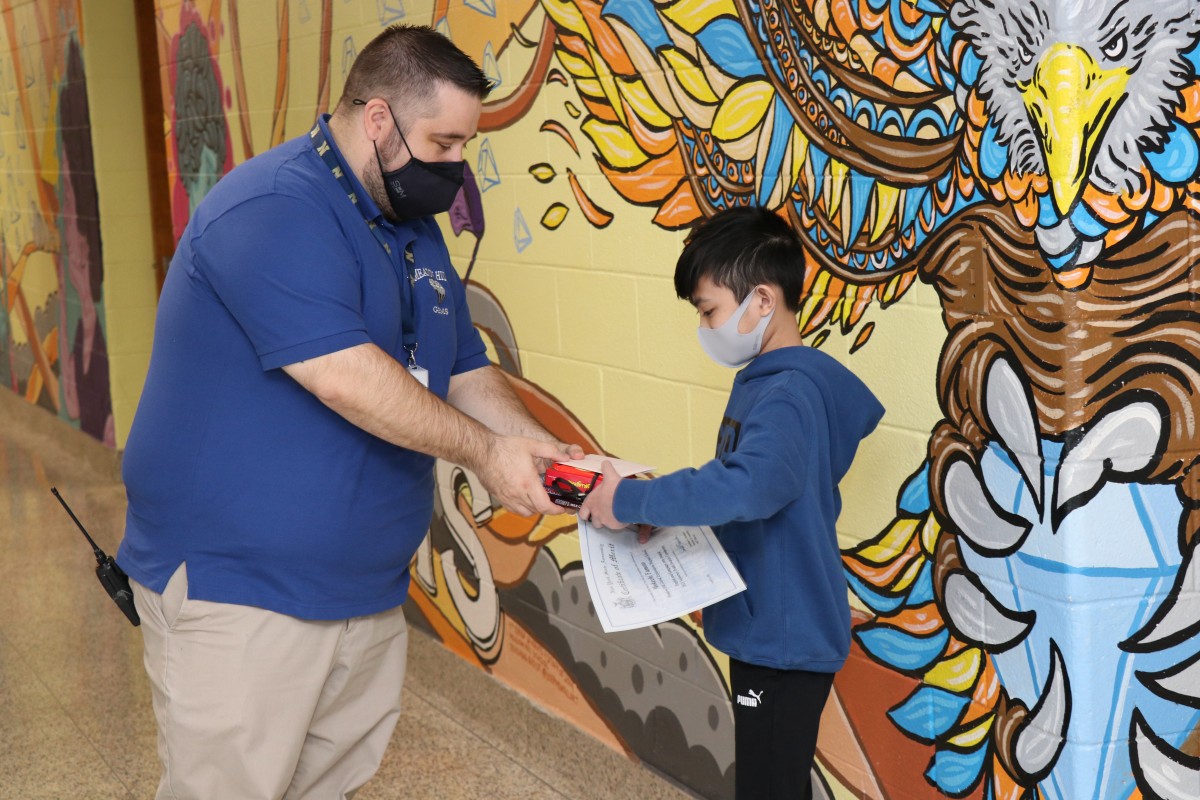 Student receiving award.