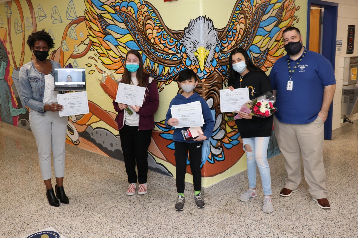 Group of recipients holding their certificates.