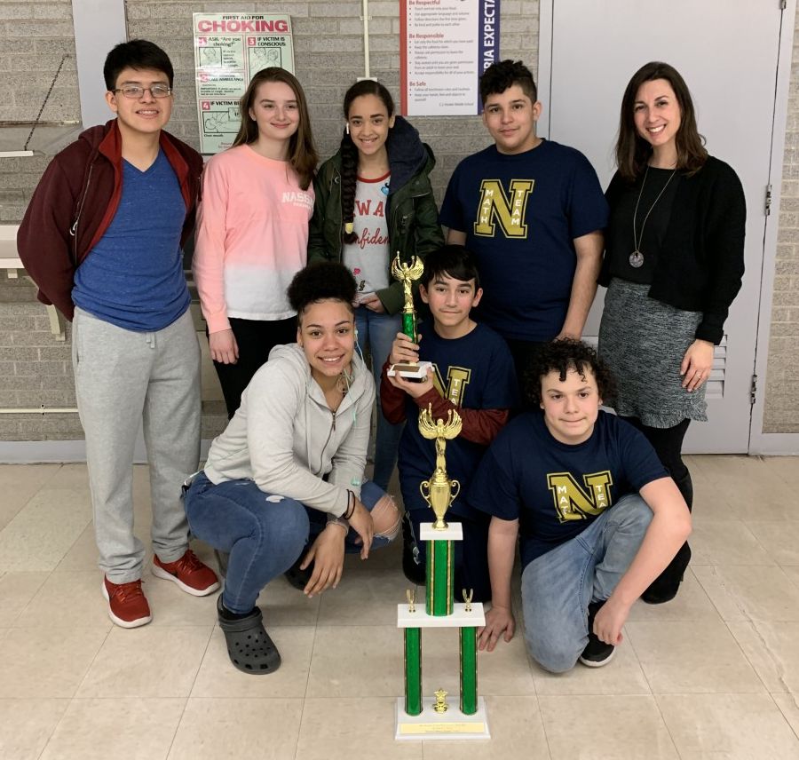 Team poses with their trophies.