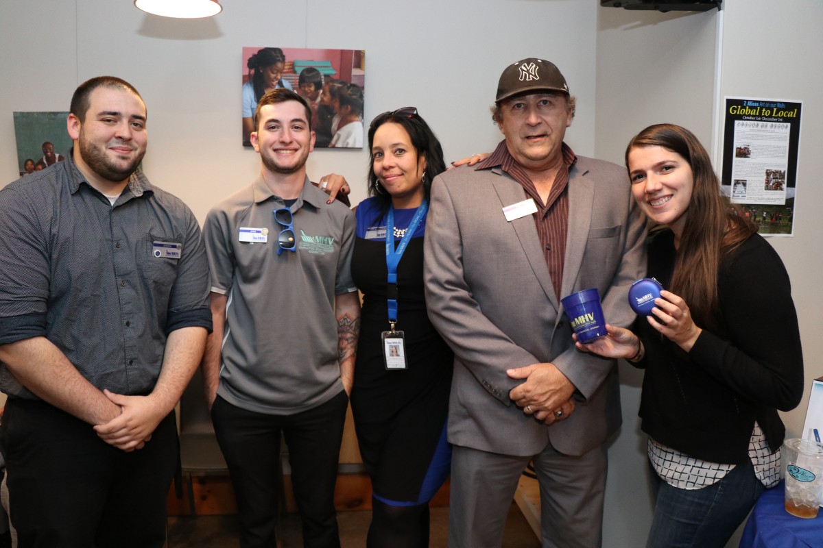 Community sponsors pose for a photo.