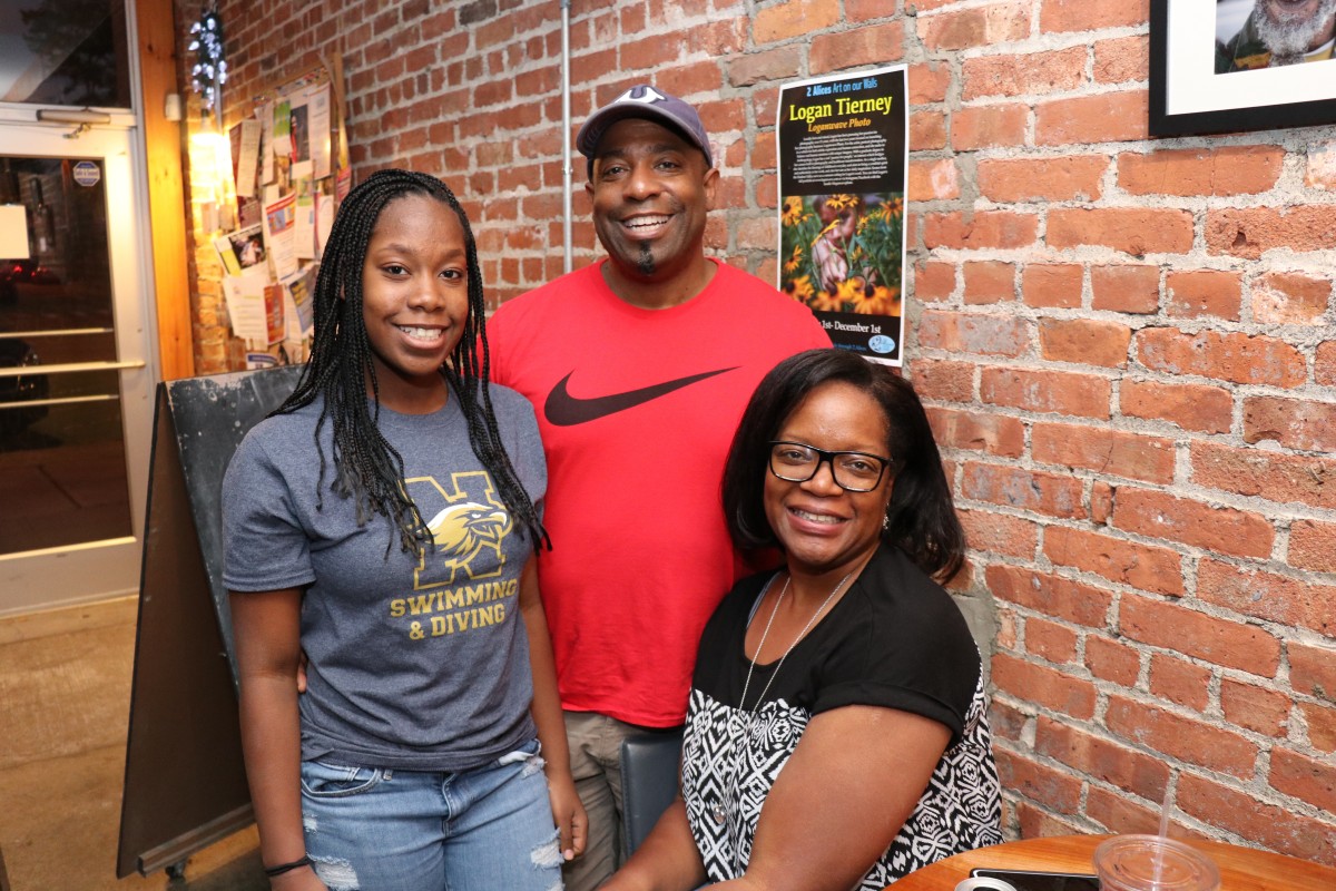 Student and her family pose for a photo.