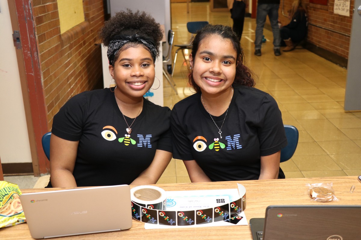 High school scholars pose for a photo.