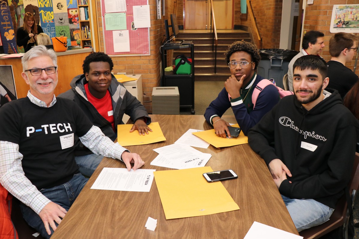 Students and mentor pose for a photo.