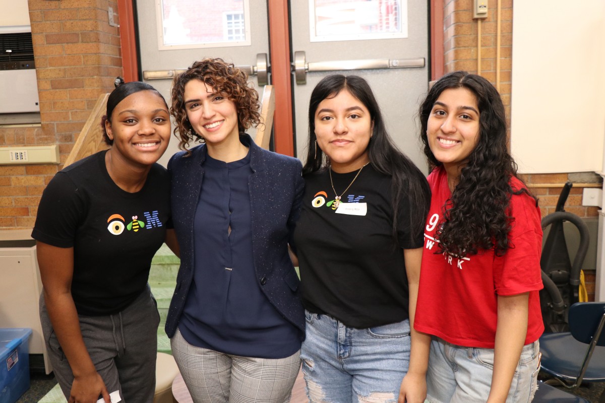 Students and mentor pose for a photo.