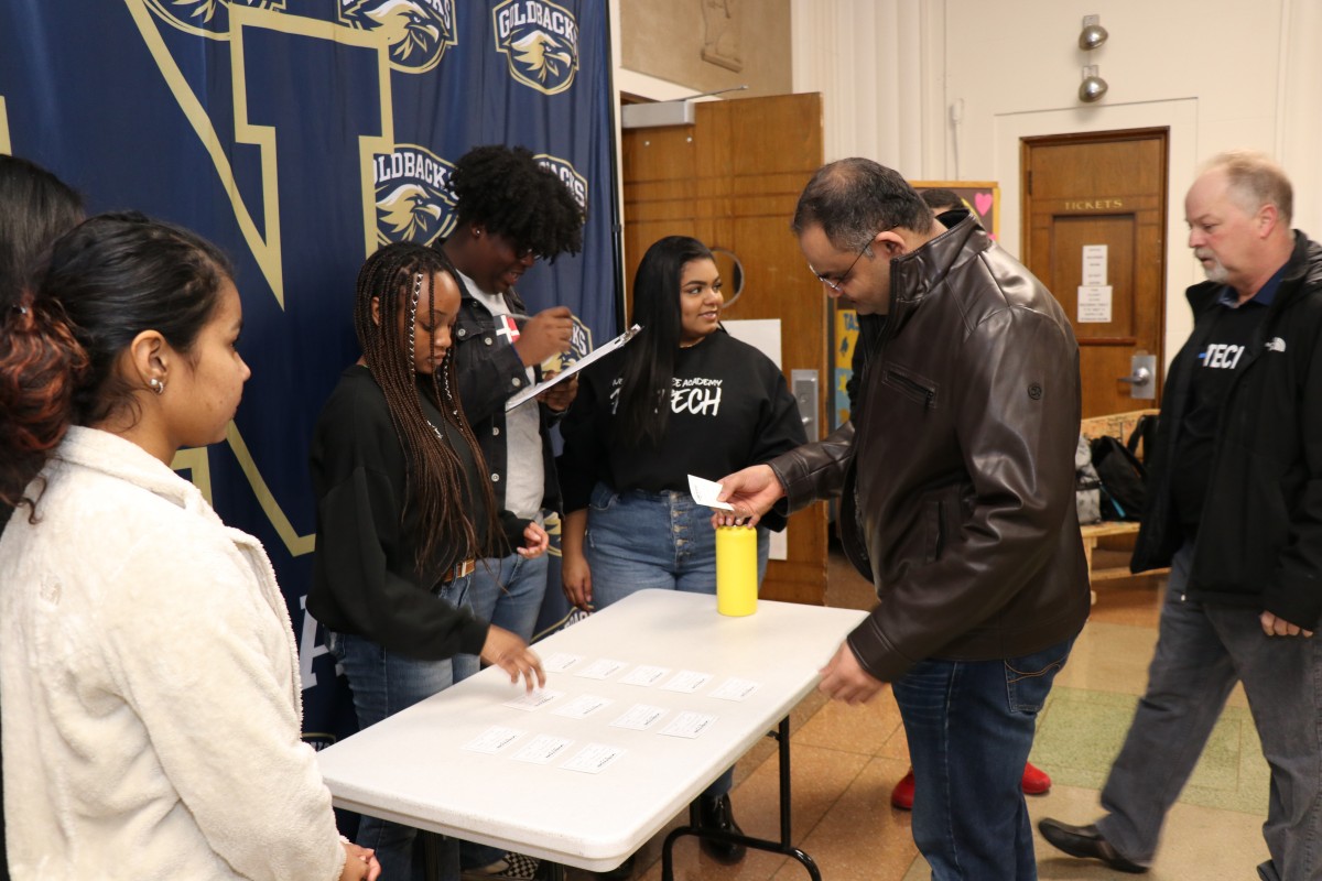 Students check in mentors as they arrive.