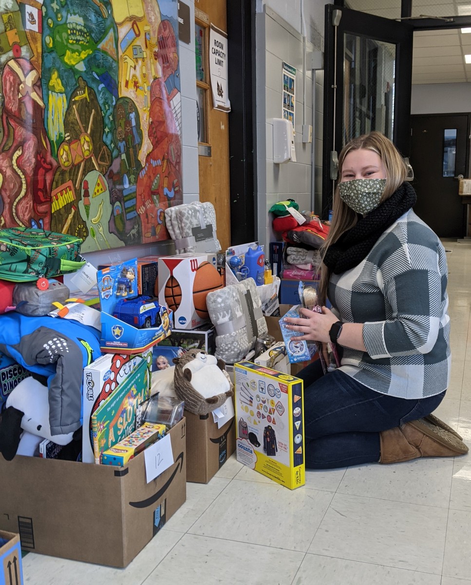 Faculty/staff member sorting donations.