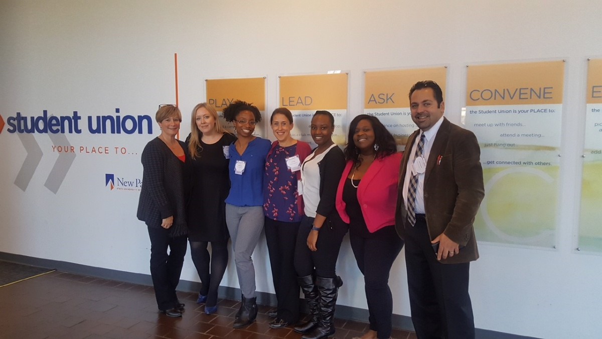 From left to right: Amy Pittari, Amy Weigel, La'Shawn Martinez, Carrie Frost, Sharol Whyte, Jessie Laguerre, Jason Michalek