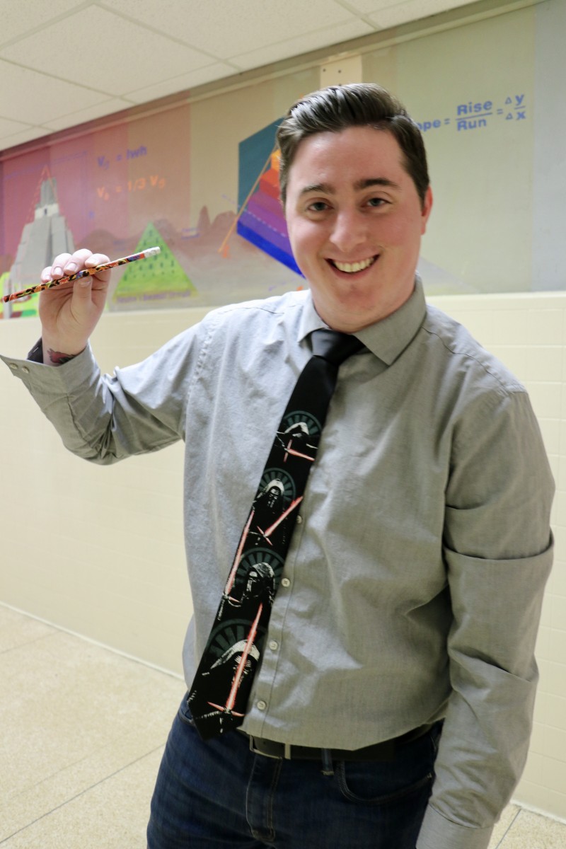 Teacher posing with his prize