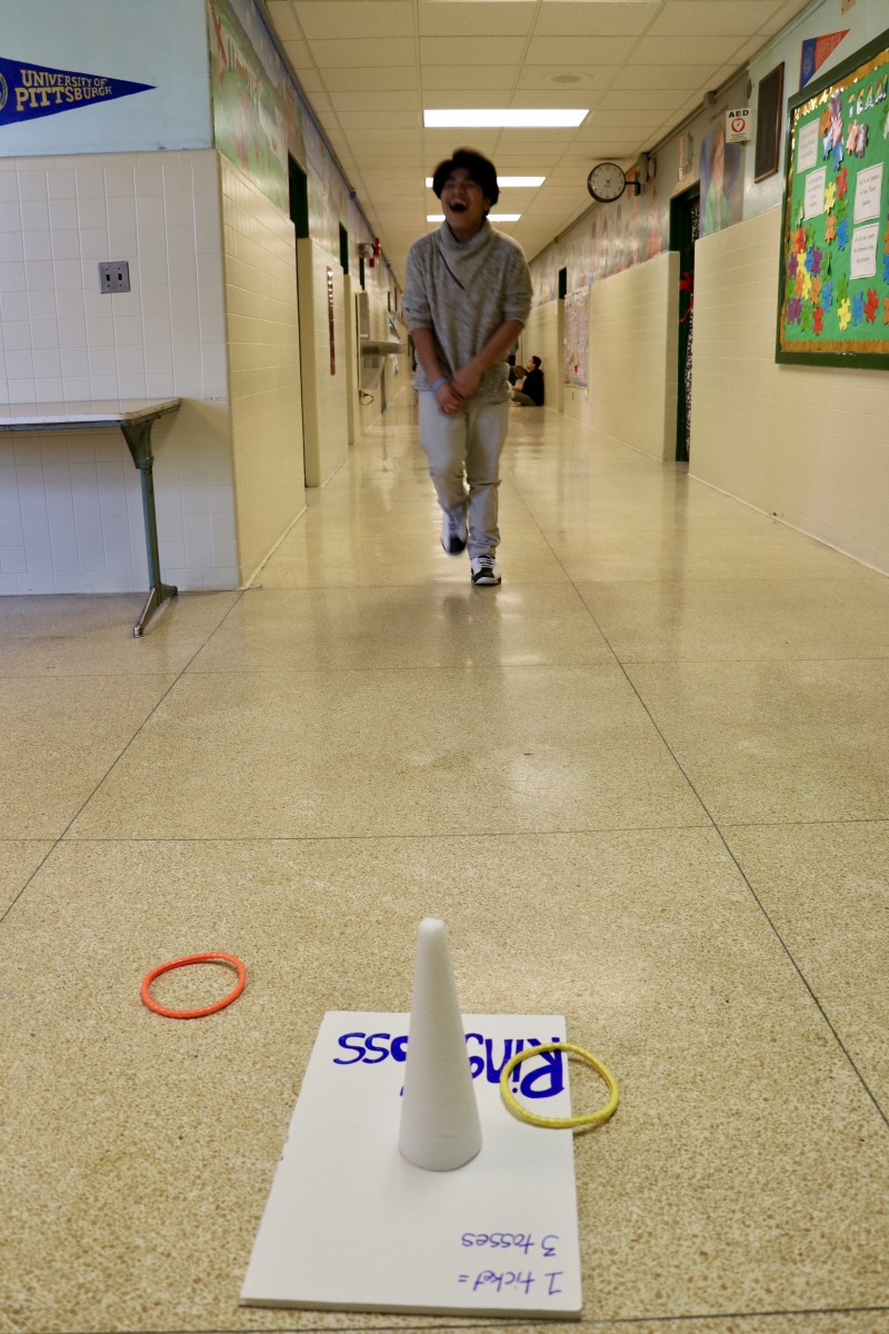 Student playing ring toss