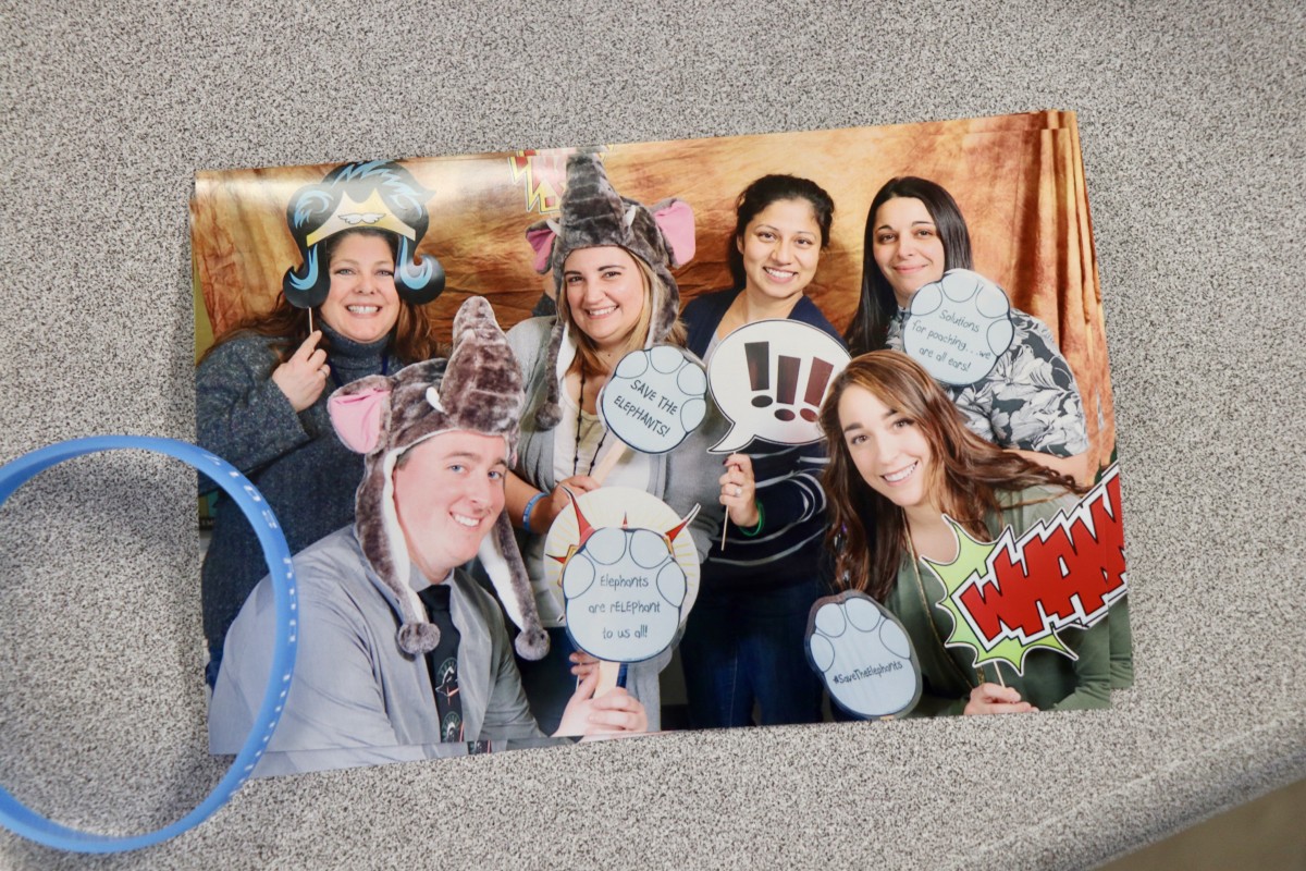 Teachers pose in picture from photo booth