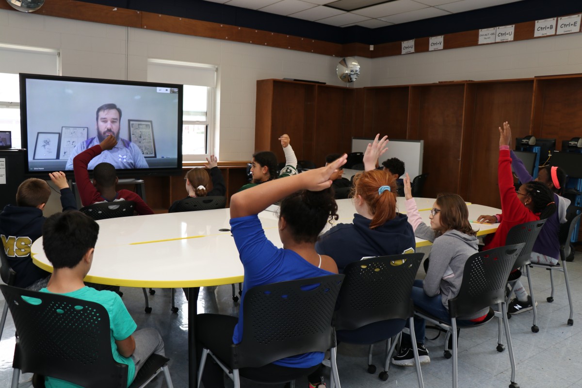 Students interact with skype presenter.