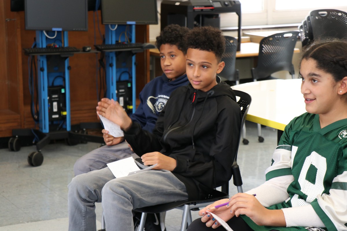 Students interact with skype presenter.