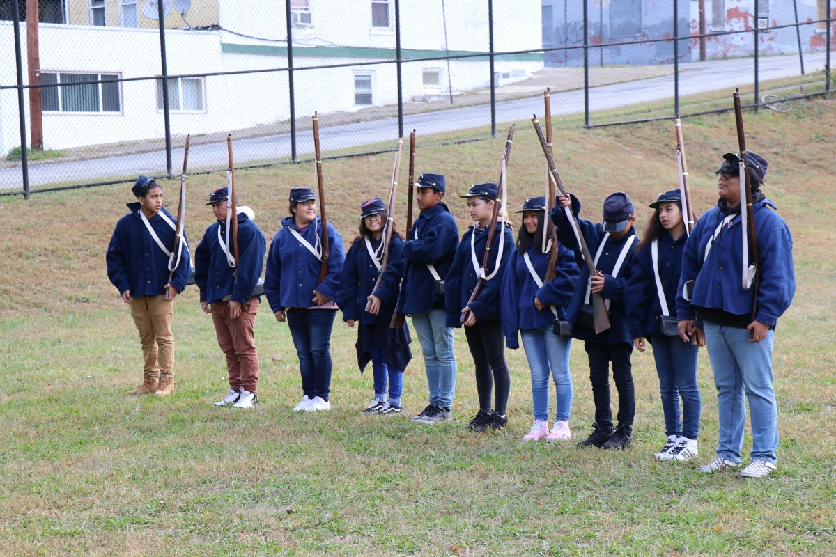 Students stand in line and learn commands.