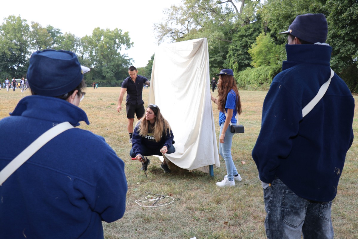 Students learn how to put up a tent.