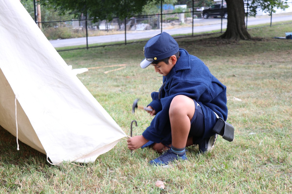 Students learn how to put up a tent.