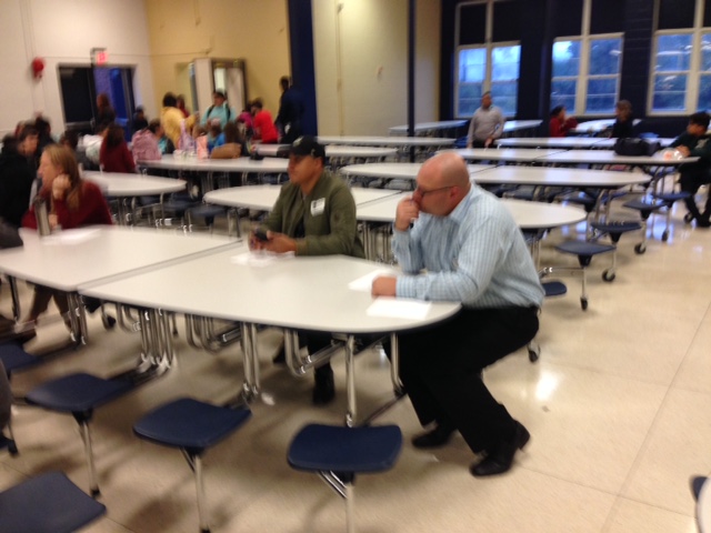 Parents engage in conversation with SMS faculty/staff.