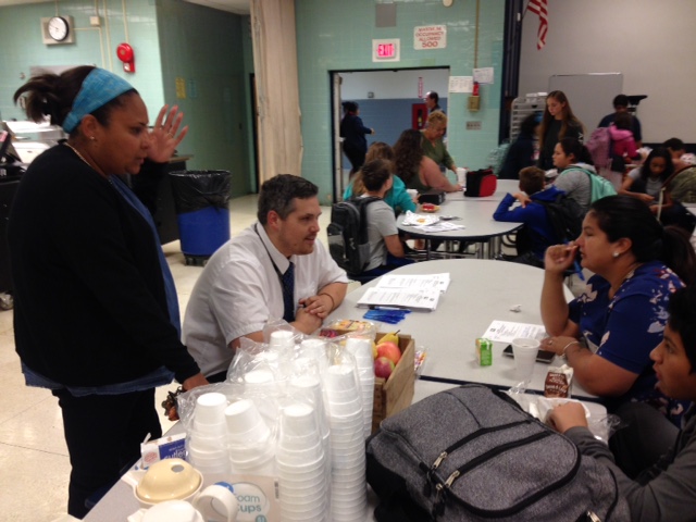 Parents engage in conversation with SMS faculty/staff.