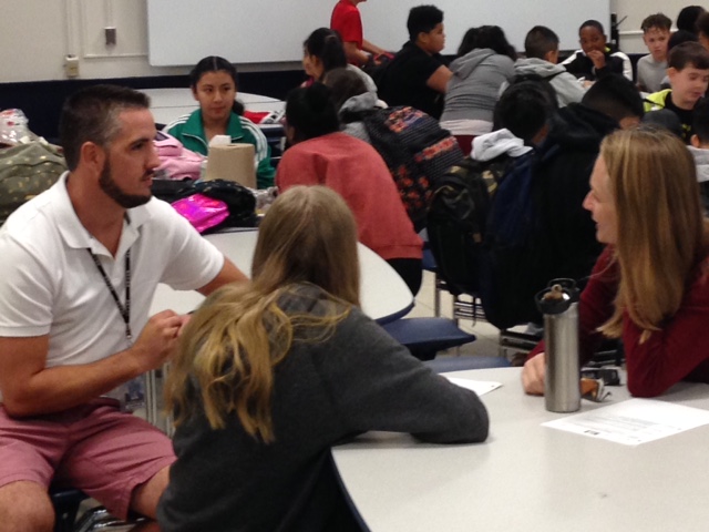 Parents engage in conversation with SMS faculty/staff.
