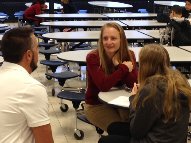 Parents engage in conversation with SMS faculty/staff.