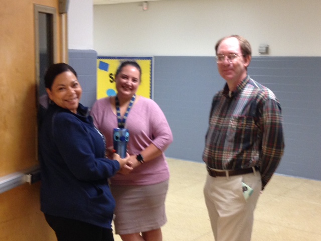 Faculty and staff pose for a photo.