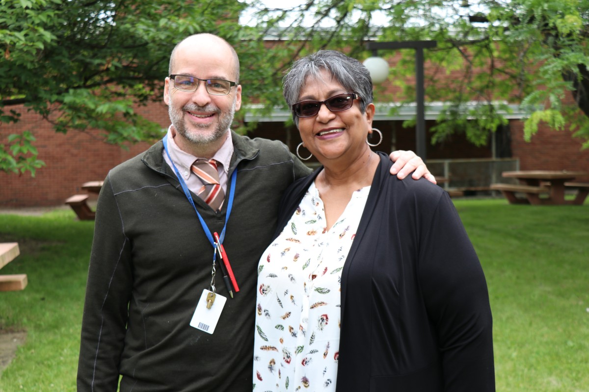 Mrs. Sukhai and Mr. Hickey pose for a photo.