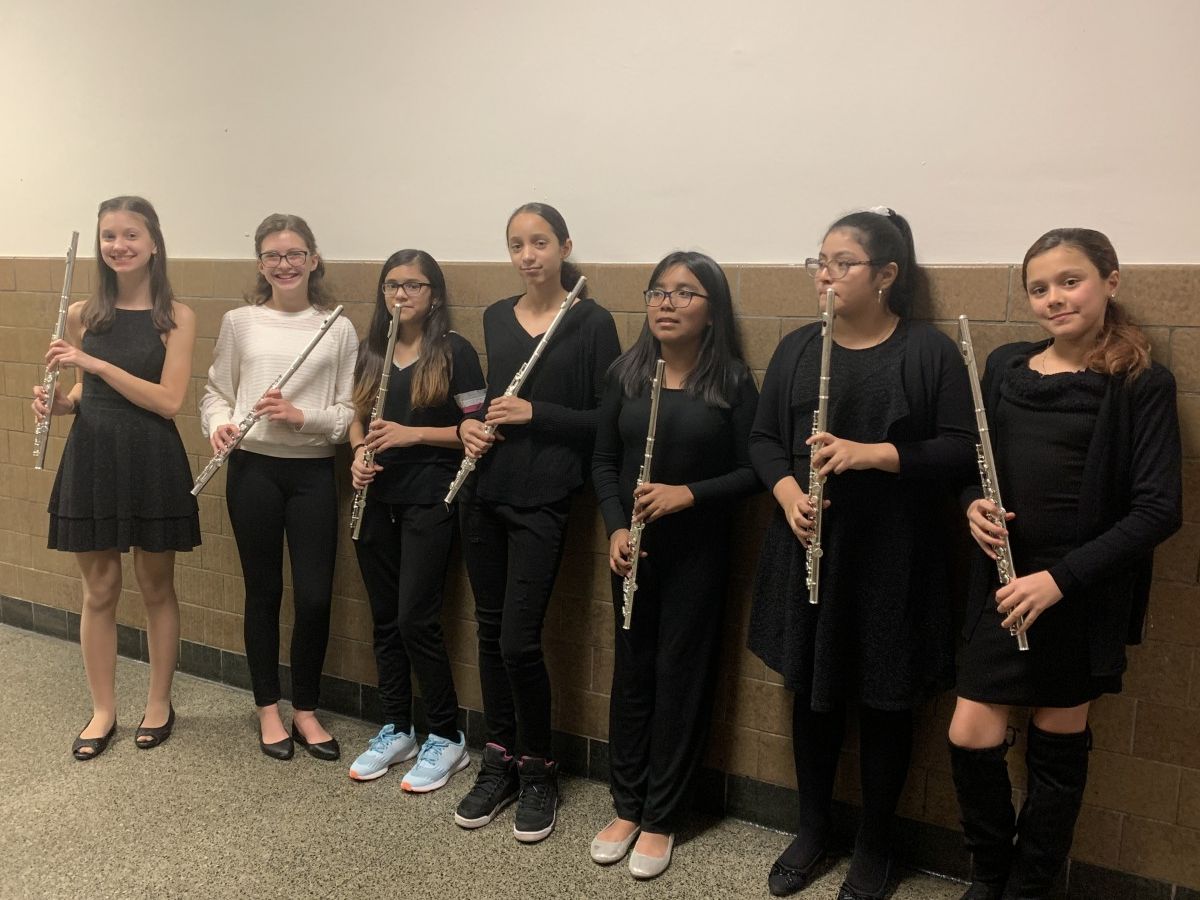 Students pose for a photo with their instruments.