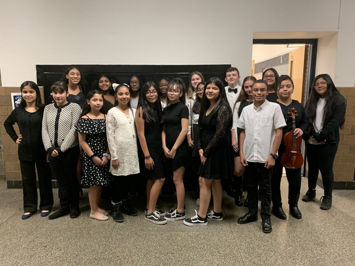 Students pose for a photo with their instruments.