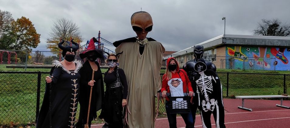 Group pose for a photo in costumes.