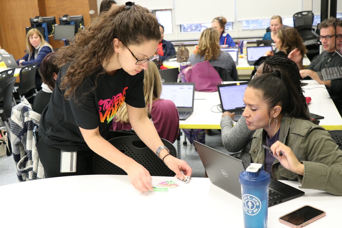 Ms. Merrill handing out stickers.