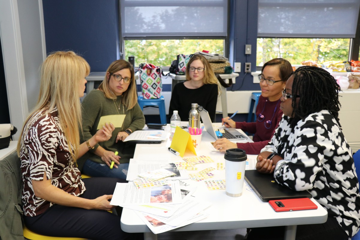 Teachers engage in professional development exercises.