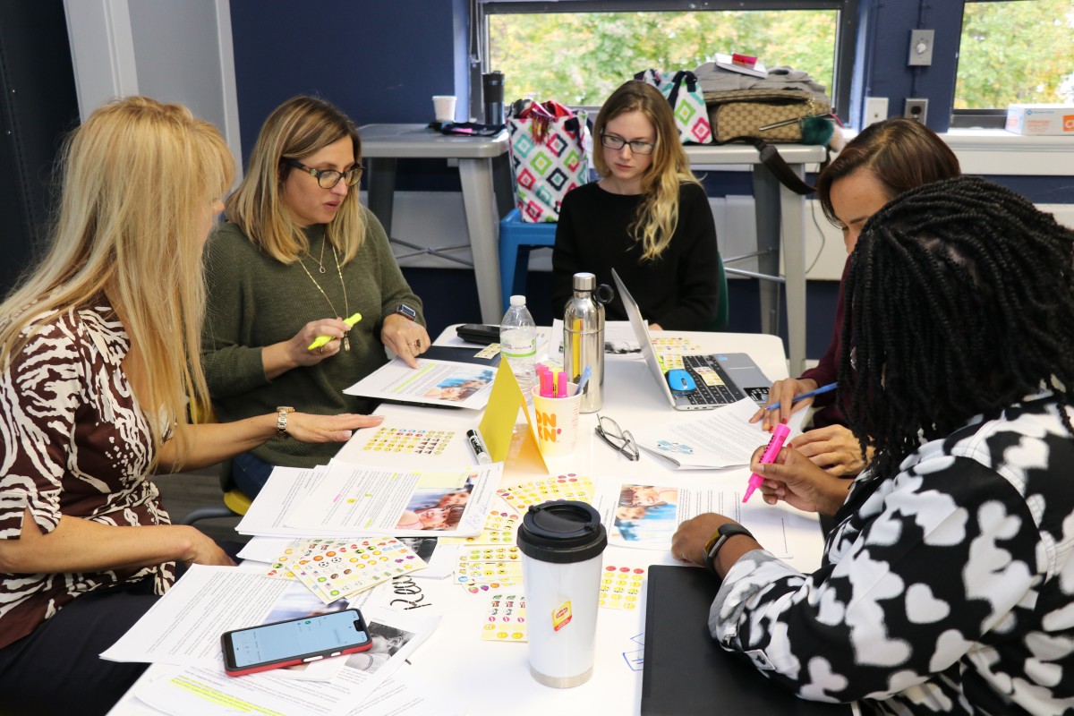 Teachers engage in professional development exercises.