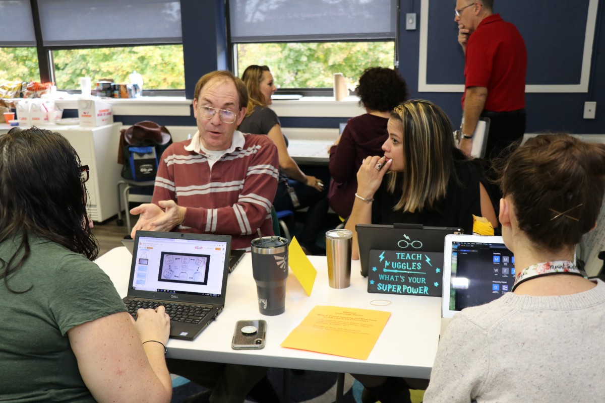 Teachers engage in professional development exercises.