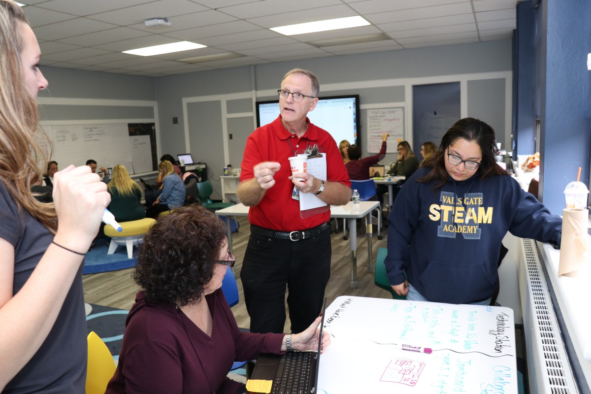 Teachers engage in professional development exercises.